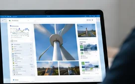 Inspection report with turbine photos on a laptop